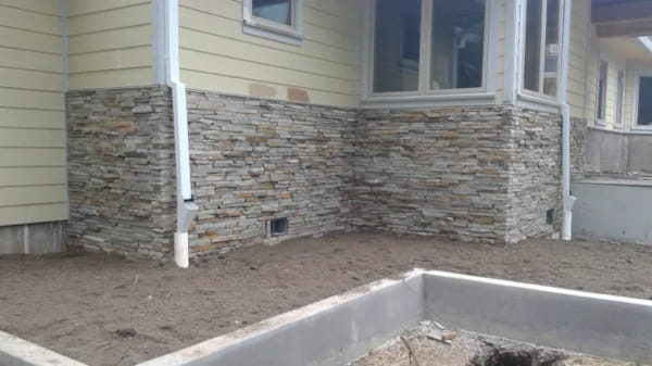 stone outside addition to wall